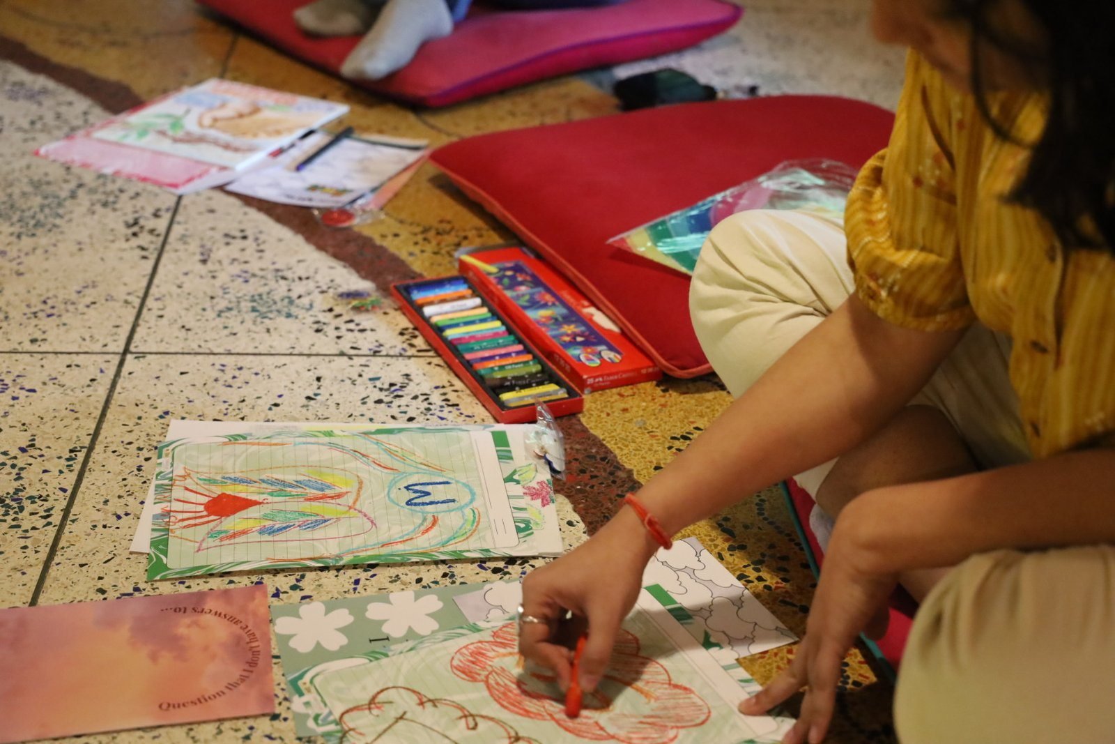Participants sitting together on the floor during a guided reflection session